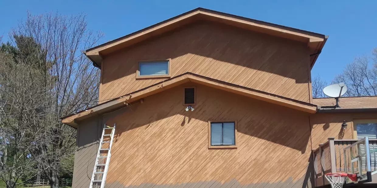 Professional Pittsburgh painters painting exterior of residential home