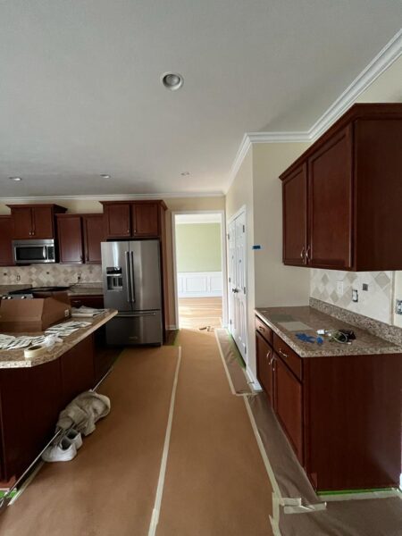 Surface preparation for quality painting showing thorough repair and priming work